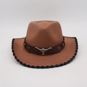 Detail of a brown fedora with silver bull head emblem and leather studded strap