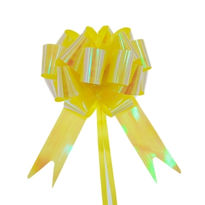 Macro detail of glossy yellow iridescent holographic gift pull bow for packaging