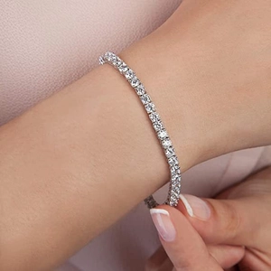 Elegant four-claw silver tennis bracelet with sparkling moissanite stones for women