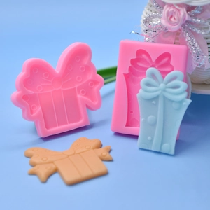 Pink silicone gift box molds with polka dots for chocolate and fondant cake decorating
