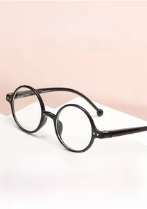 Detailed view of vintage round black frame reading glasses with blue light blocking lenses