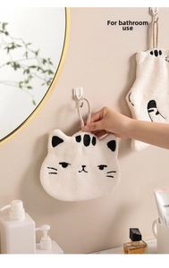 Close-up of white cat-shaped hanging hand towel with soft microfiber texture in bathroom