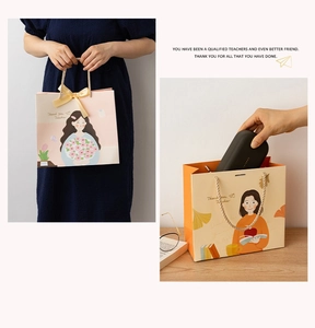 Pink Teacher appreciation gift bag with Thank You text and decorative golden bow