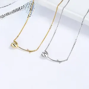 Detail of minimalist 925 sterling silver tulip necklaces in gold and silver colors