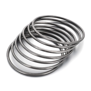 Minimalist 3mm matte black stainless steel circular bangles stacked on white background
