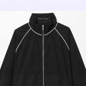 Women black nylon puffer jacket with white piping details and stand collar zip-up