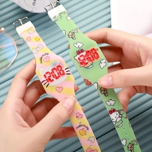 Detail of pink and green LED kids watches with cartoon silicone straps and digital display