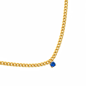 Detail of 18k gold plated Cuban chain necklace featuring a blue zircon gemstone pendant