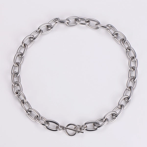 Detailed close-up of chunky silver stainless steel link chain with OT toggle clasp