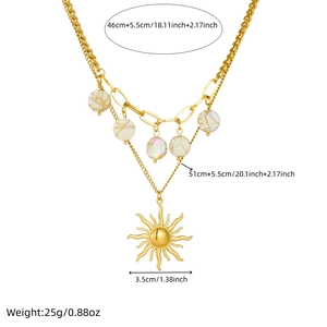 Double-layered gold stainless steel necklace with sun pendant and white beads on white background