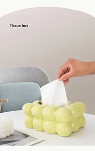 Detail view of the wide-mouth opening on the light green bubble ceramic tissue box
