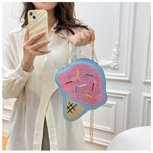 Detail of pink and blue ice cream bag with sequins and golden metal chain strap