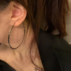 Minimalist large silver circle hoop earrings for women in a stylish oversized metal design