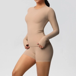 Detail of light coffee tight yoga set with long sleeve thumb hole top and high waist shorts