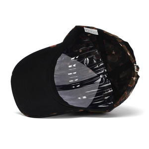 Detail of black baseball cap interior with floral lining and adjustable metal buckle