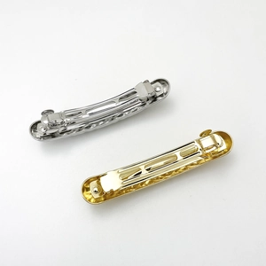 Macro shot of gold and silver metallic spring hair barrette bases for hair accessory DIY
