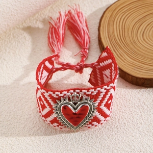 Bohemian hand-woven bracelet with red heart pendant and crown charm detailing