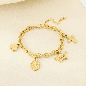 Detail shot of a chunky 18K gold plated chain bracelet with cross and angel charms