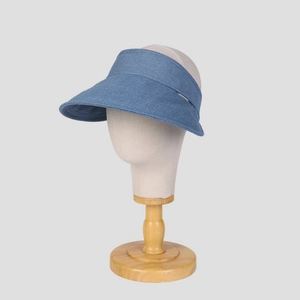 Side view of a blue denim texture sun visor displayed on a professional mannequin stand