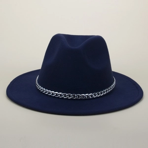 Detail of navy wool fedora hat featuring a chunky silver metal curb chain decoration
