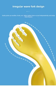 Detail of yellow toddler training fork with wavy tines for easy food gripping