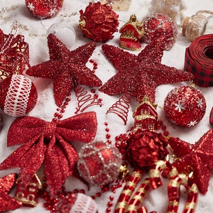 Champagne gold and red glitter Christmas star ornaments set on a white snowy background