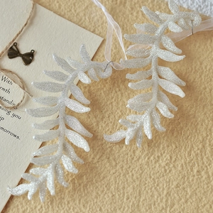 Sparkling silver glitter fern leaf Christmas tree ornament with elegant white ribbon