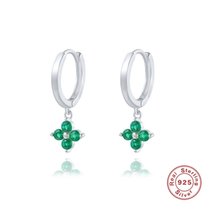 Macro detail of 925 sterling silver hoop earrings with green clover-shaped zircon stones
