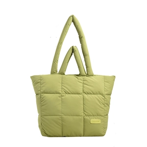 Avocado green quilted puffer tote bag with dual handles and fashion brand label