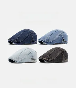 Detail of four denim ivy caps with adjustable metal buckles and contrast stitching