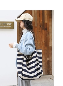Detail of navy and white striped canvas tote bag showing large capacity and thick texture