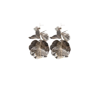 Exaggerated silver flower tassel earrings with hollow layered petal design for women