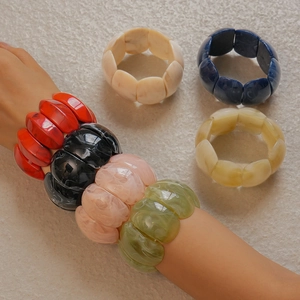 Macro shot of colorful acrylic resin bracelets with marbled patterns and geometric cut