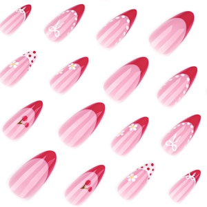 Short almond press-on nails with red French tips, cherry patterns and floral designs