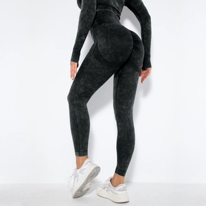 Detail of seamless acid wash yoga set featuring high-waisted leggings and long sleeve crop top