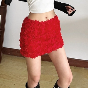 Detailed view of the 3D red rose petal texture on this sexy mini skirt for women
