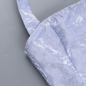 Detailed macro view of the lavender floral jacquard fabric and high-quality stitching texture