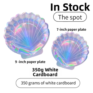 Close-up of shell-shaped iridescent paper plates with laser rainbow reflective finish