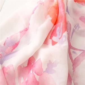 Close-up of lightweight watercolor floral cotton linen scarf showing herringbone texture