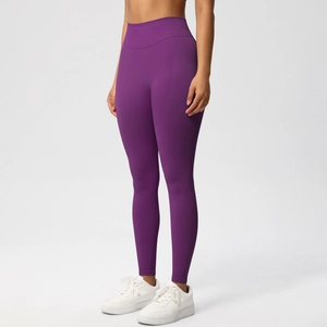Detail view of high-waist purple seamless yoga leggings with peach butt-lifting effect