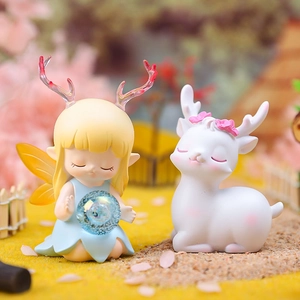 Cute resin fairy girl with blue ball and white deer figurine in a mini garden setting