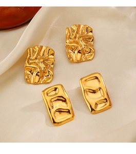 Detail view of two pairs of 18K gold-plated irregular and rectangular ripple stud earrings