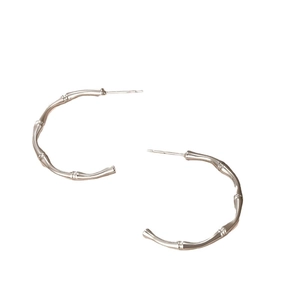 Minimalist silver bamboo joint C-shape hoop earrings with a polished metallic finish