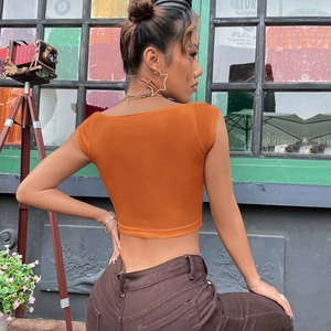 Detail of orange ribbed knit crop top back view showing slim fit and square neckline