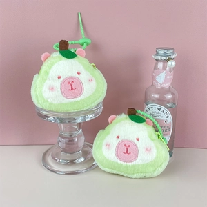 Detail of cute green plush animal coin purse with embroidery and spring lanyard