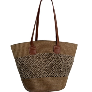 Retro brown woven tote bag with leather handles in a minimalist bucket style design