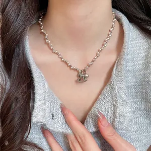 Elegant silver bead chain necklace with zircon horse pendant and white pearl detail