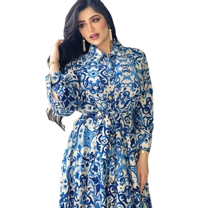 Elegant blue Majolica print shirt dress with long sleeves, waist tie, and gold buttons