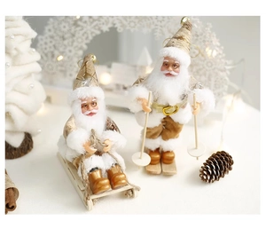 Detailed view of Santa figurines on sleigh with warm holiday lights and Christmas tree