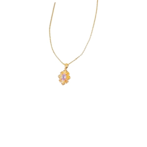Vintage gold necklace with a floral zircon pendant featuring a purple center stone